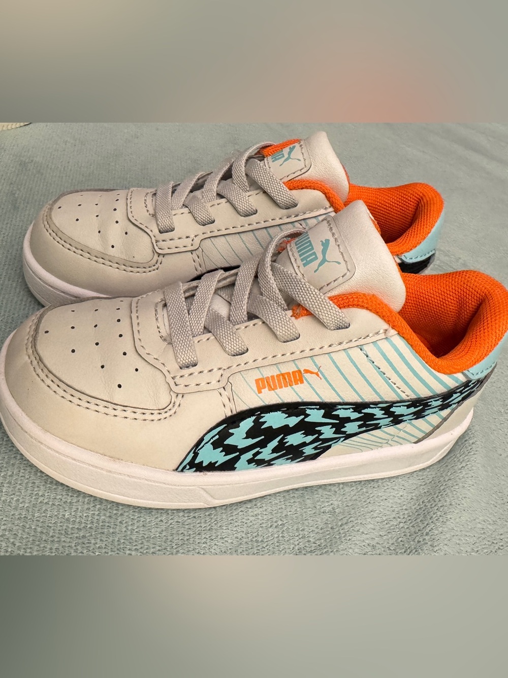 Puma Kids White Sneakers with Orange Lining and Aqua Logo